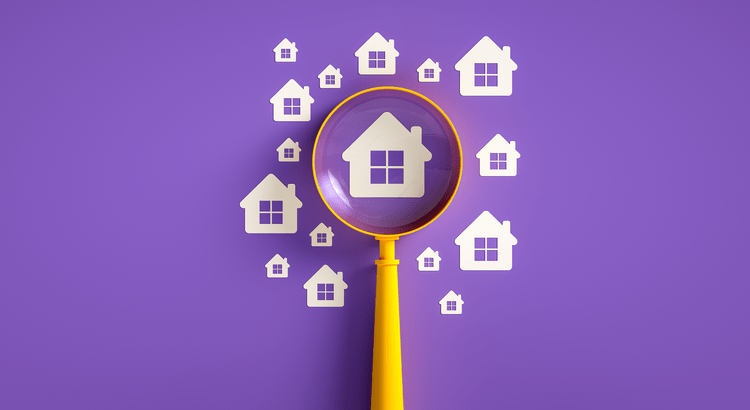 Magnifying glass focusing on a house icon among many on a purple background.
