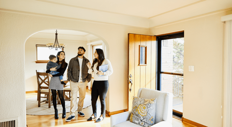 Group of young people enjoying coffee in a cozy living room.